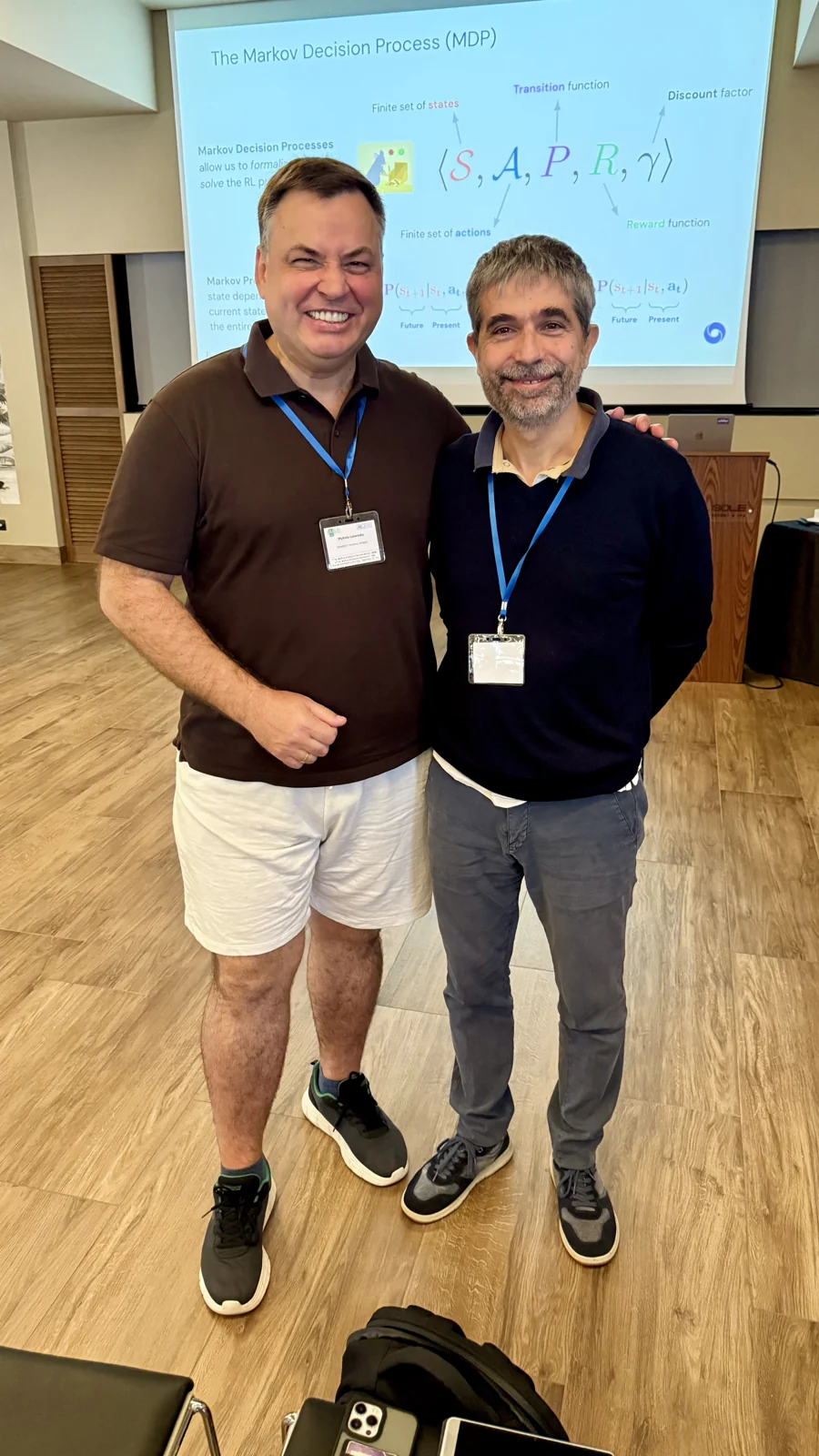 Mykola Latansky with an IAISS 2026 researcher in the lecture room