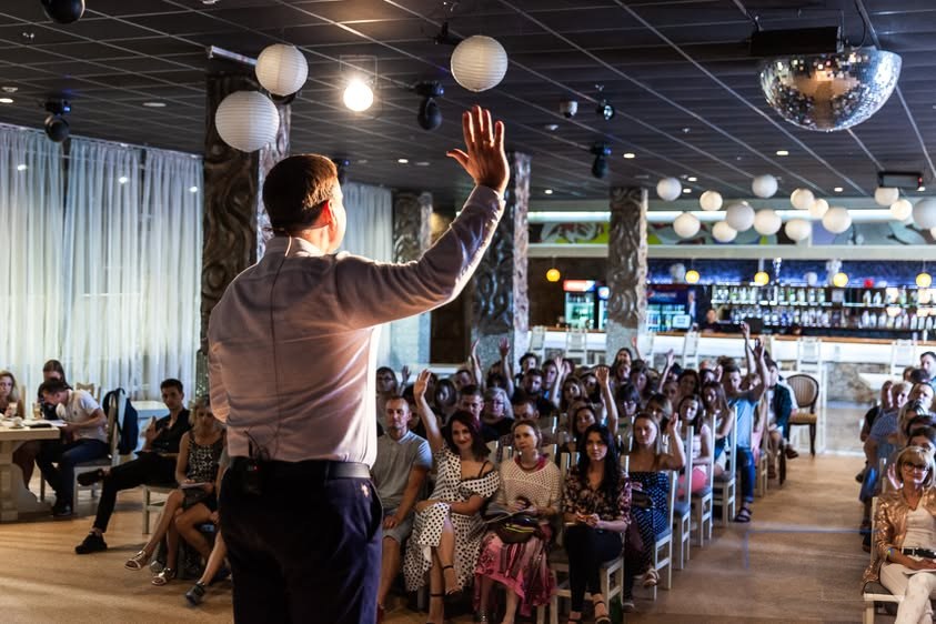 View from behind Mykola Latansky facing an engaged audience in Lutsk