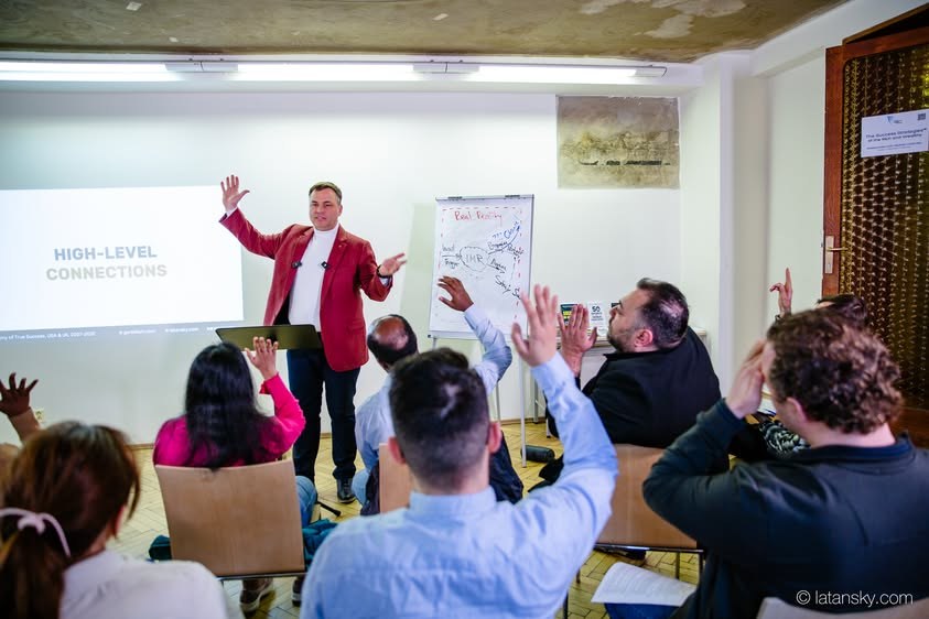 Mykola Latansky engaging participants in a discussion in Prague